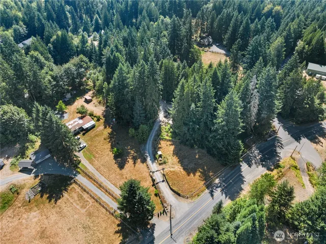a view of house with yard outdoor seating and barbeque oven