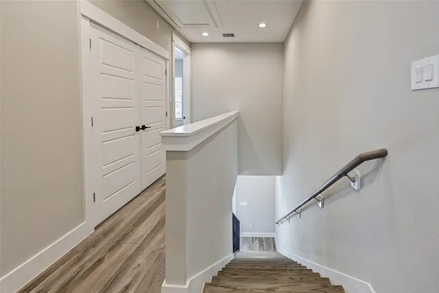 a view of a hallway with staircase