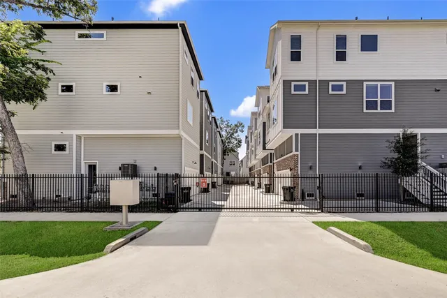 a view of multiple house with a yard