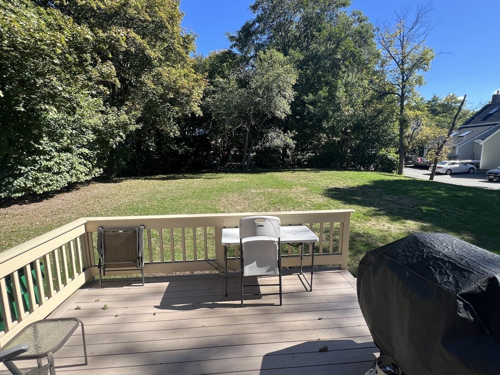 1050 Chestnut Street, Unit 1050 Newton, MA 02464 - Photo 13 of 13 a view of a yard with a deck