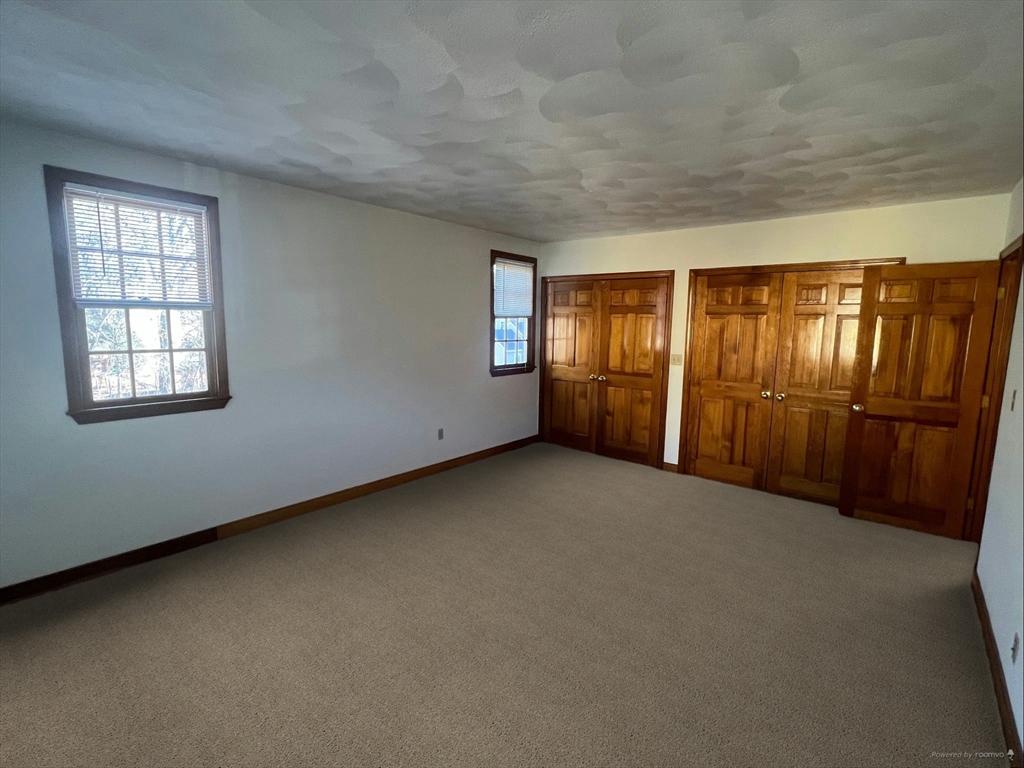 1050 Chestnut Street, Unit 1050 Newton, MA 02464 - Photo 6 of 13 an empty room with windows