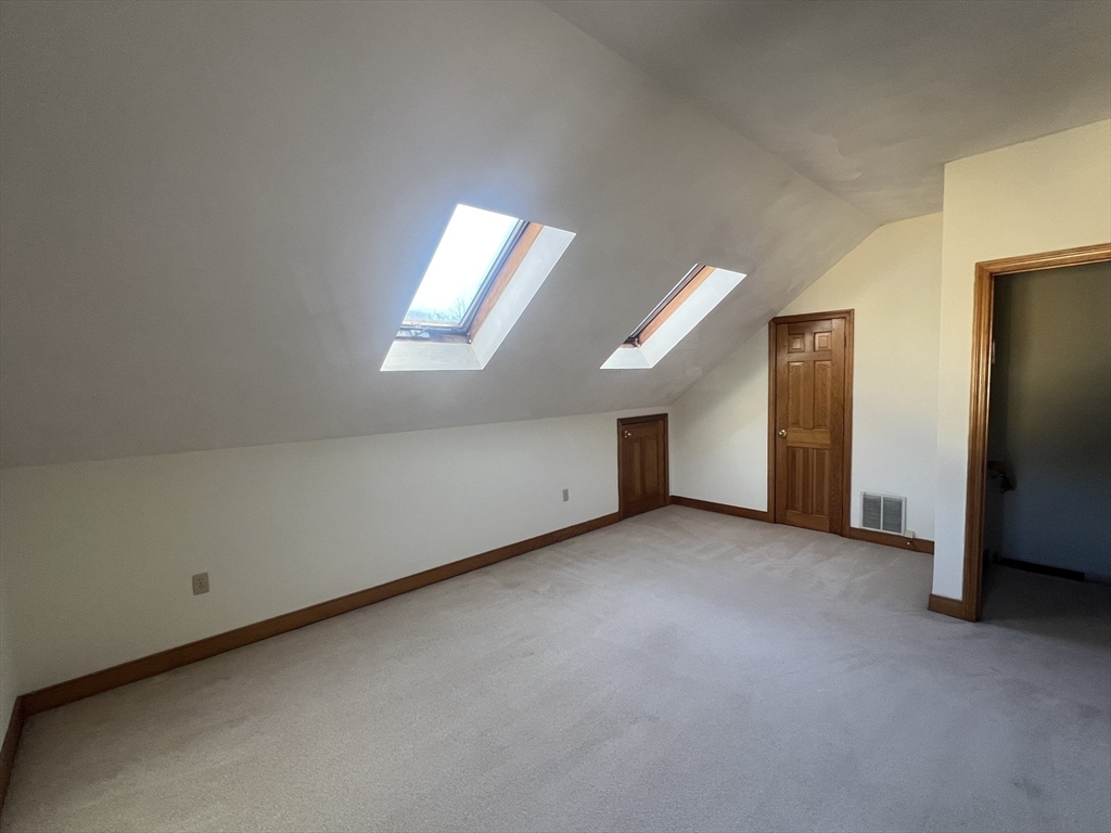 1050 Chestnut Street, Unit 1050 Newton, MA 02464 - Photo 10 of 13 an empty room with windows