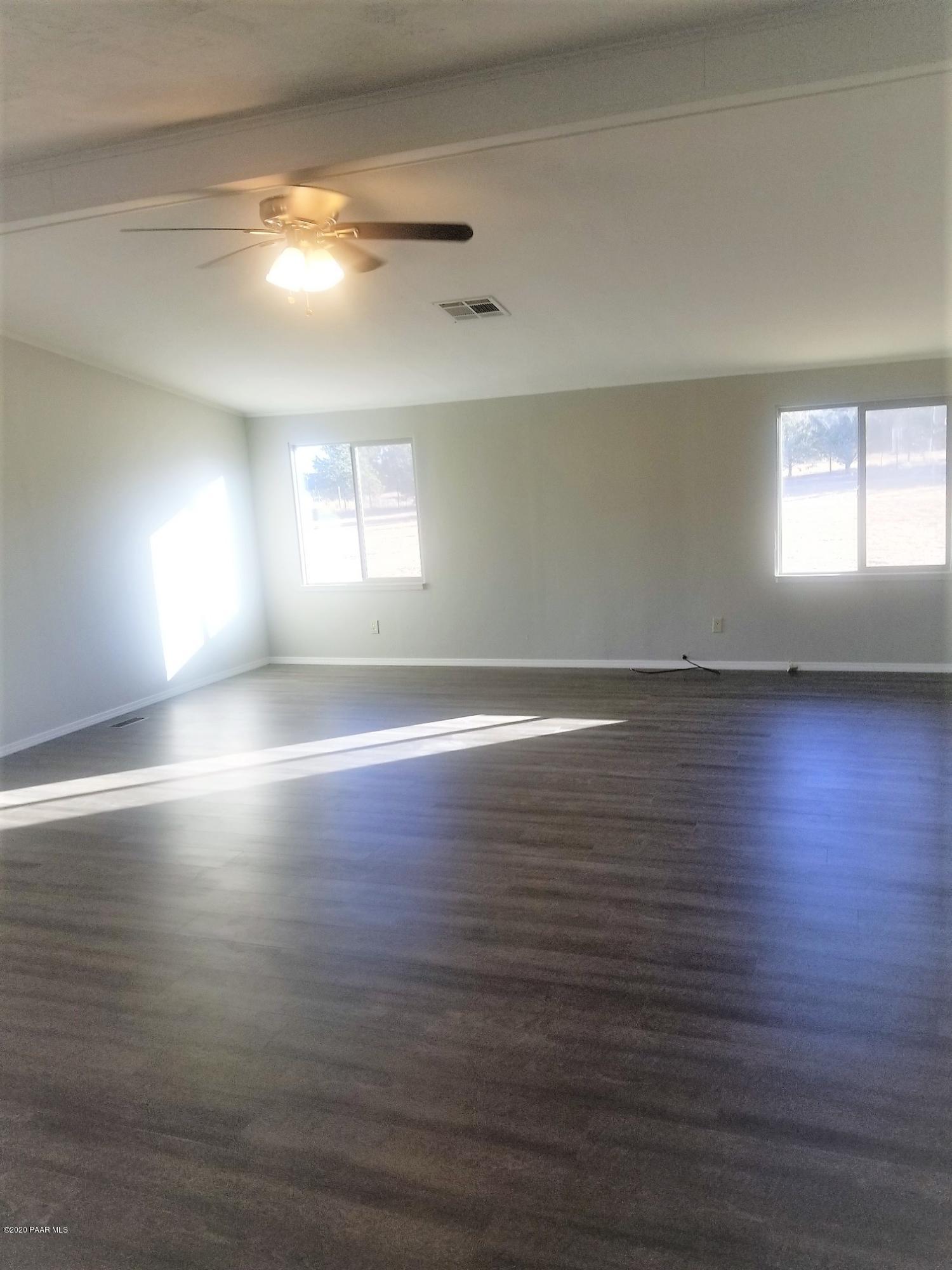 3361 North Reed Road Chino Valley, AZ 86323 - Photo 17 of 29 an empty room with wooden floor and windows