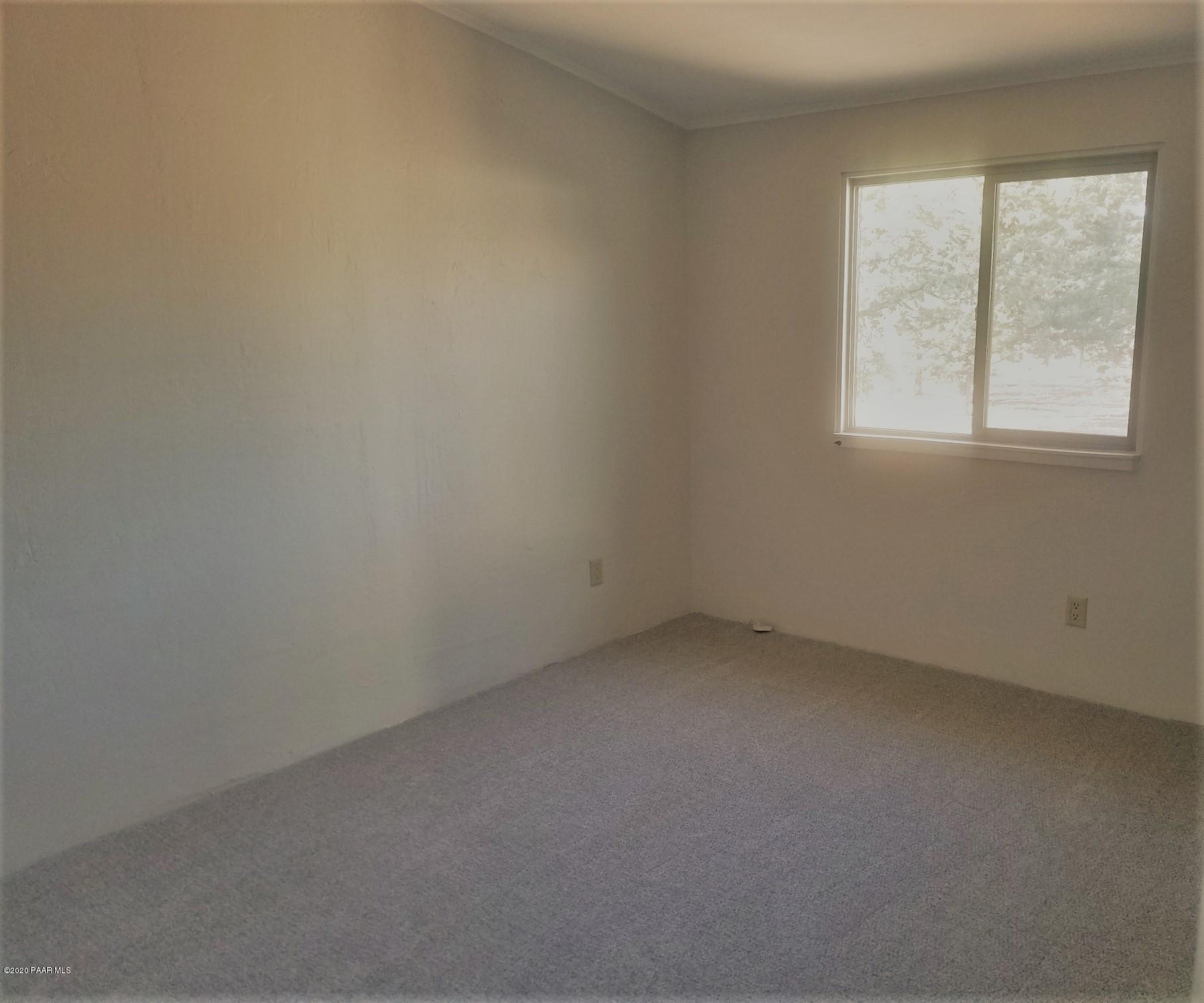 3361 North Reed Road Chino Valley, AZ 86323 - Photo 19 of 29 an empty room with a window