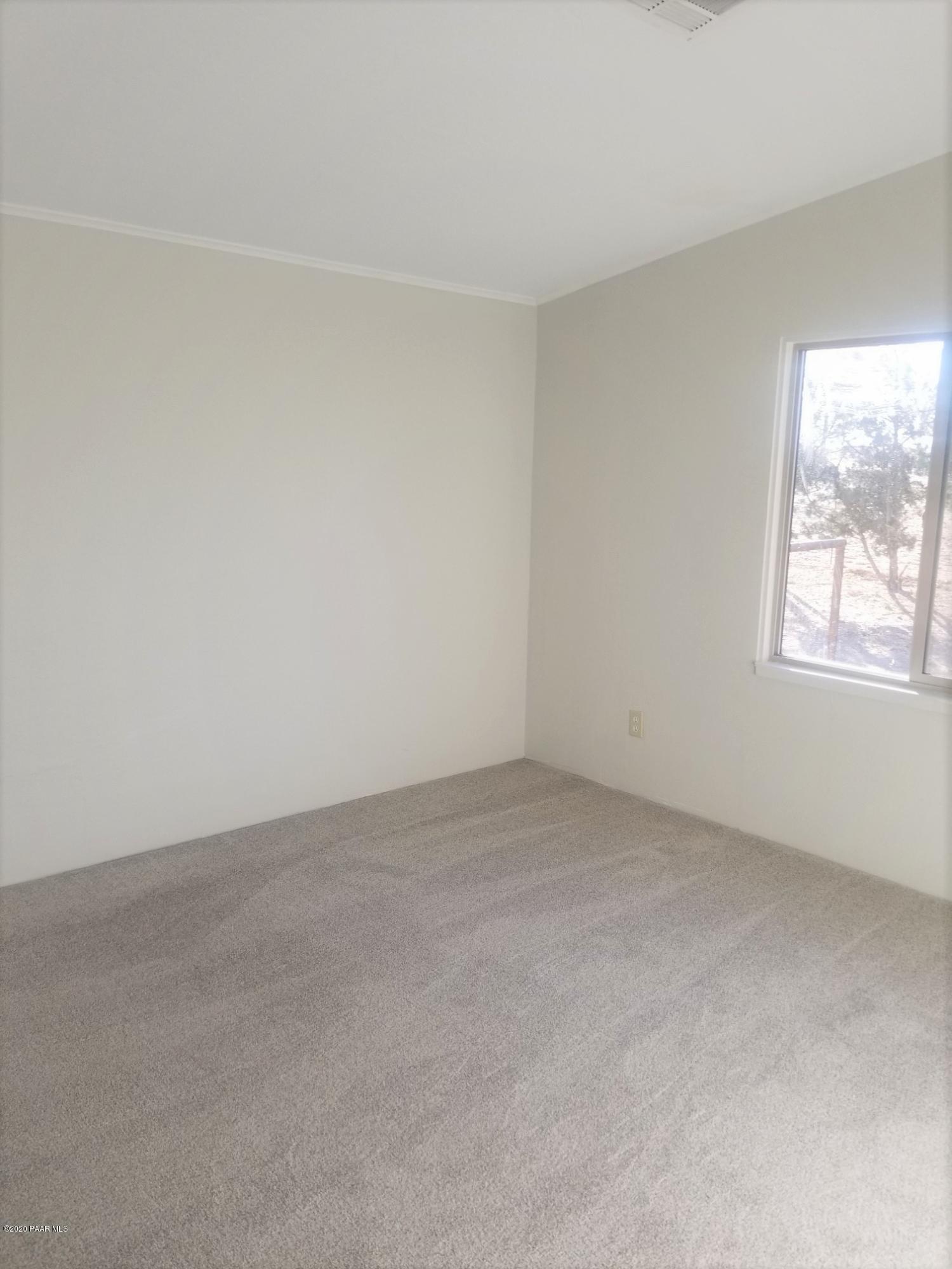 3361 North Reed Road Chino Valley, AZ 86323 - Photo 20 of 29 an empty room with a window