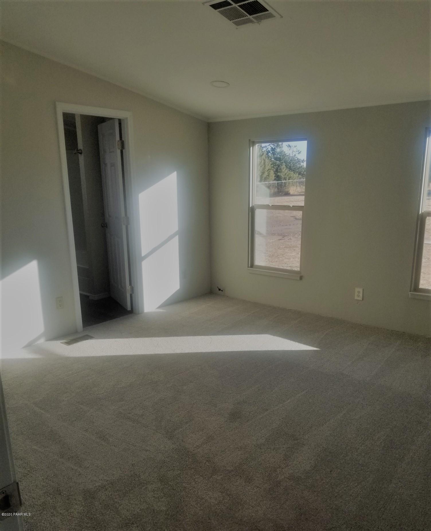 3361 North Reed Road Chino Valley, AZ 86323 - Photo 22 of 29 an empty room with windows