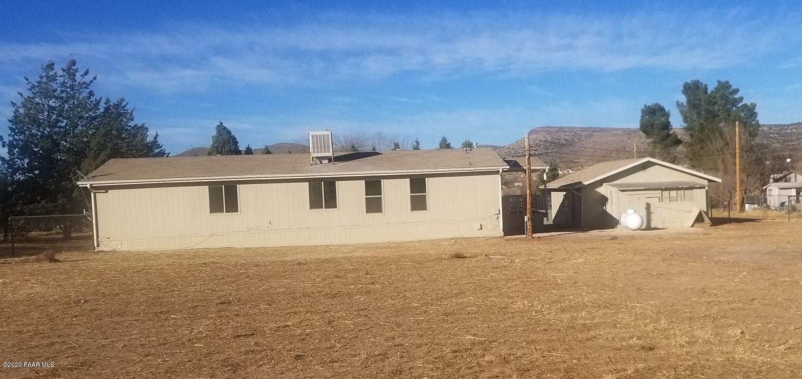 3361 North Reed Road Chino Valley, AZ 86323 - Photo 29 of 29 a front view of a house with a yard