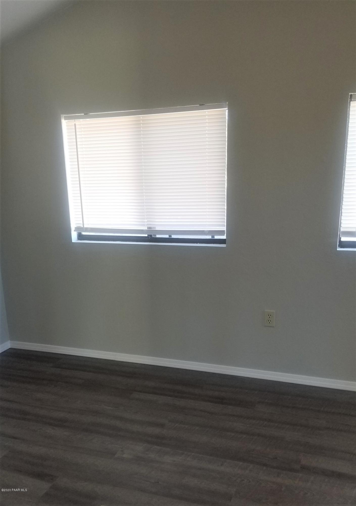 3361 North Reed Road Chino Valley, AZ 86323 - Photo 8 of 29 a view of a small space with wooden floor and a window