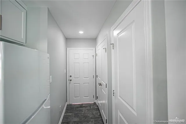 a view of a livingroom with a ceiling fan and window