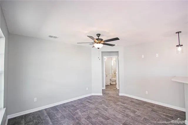 a view of an empty room with a window