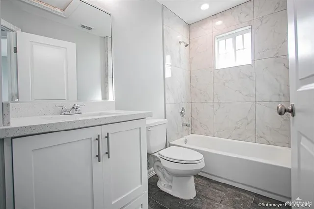 a view of a house with a small backyard