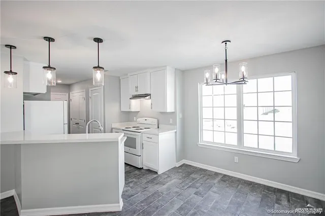 a view of a kitchen with windows