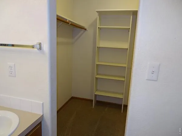 a view of an empty walk in closet