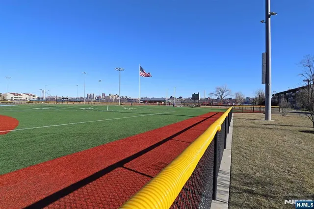 a view of swimming pool with a yard