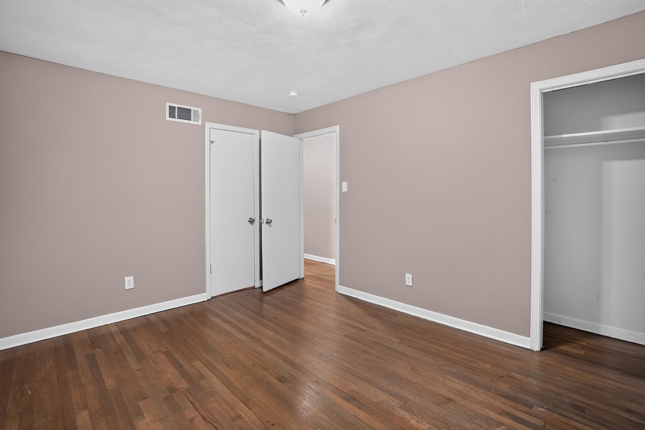3391 South Perkins Road Memphis, TN 38118 - Photo 13 of 16 Interior space featuring wood-finish flooring, light taupe walls, and white baseboards