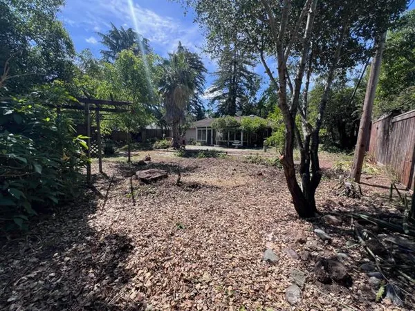 a backyard of a house with lots of green space