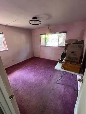 an empty room with windows