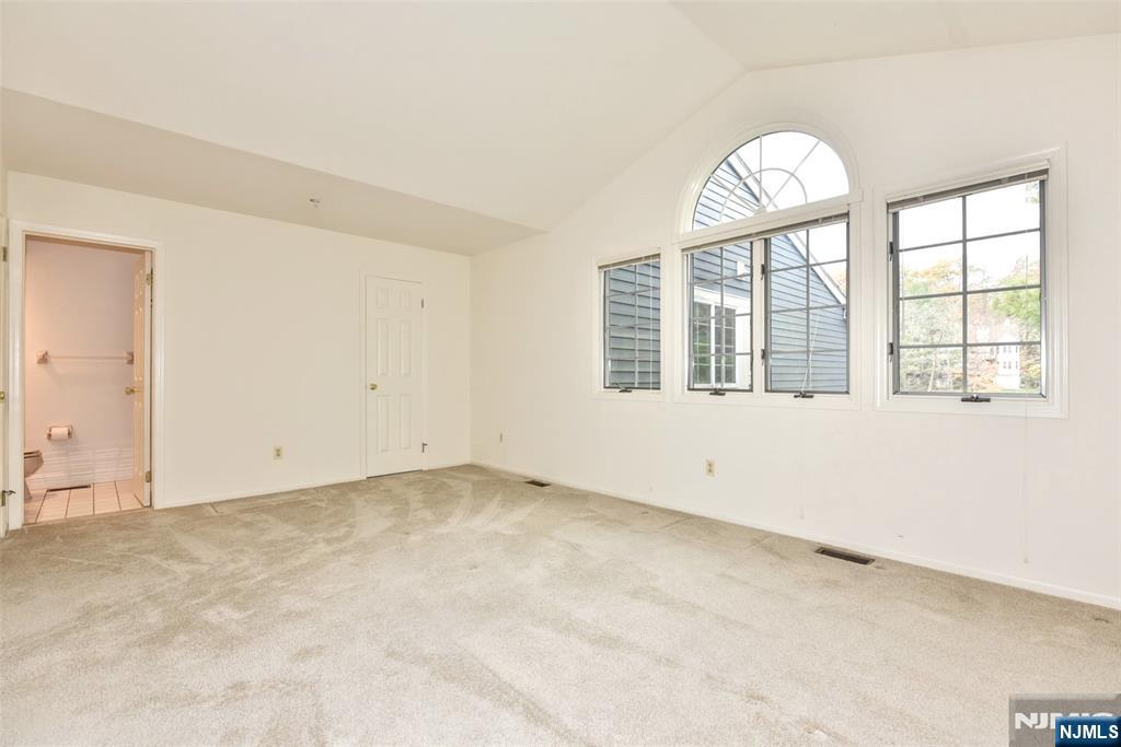 339 Cambridge Drive Ramsey, NJ 07446 - Photo 17 of 26 an empty room with windows