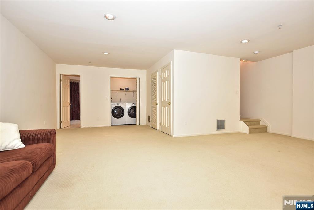339 Cambridge Drive Ramsey, NJ 07446 - Photo 20 of 26 a big room with windows and closet