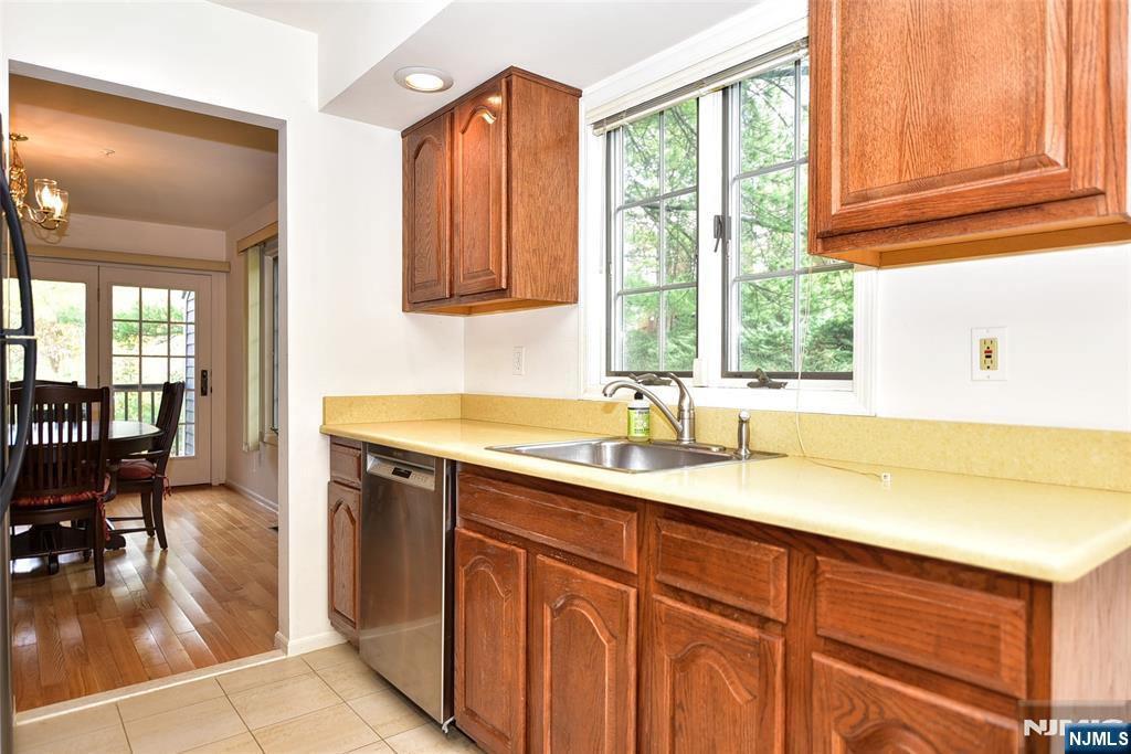 339 Cambridge Drive Ramsey, NJ 07446 - Photo 10 of 26 a bathroom with a sink and a window