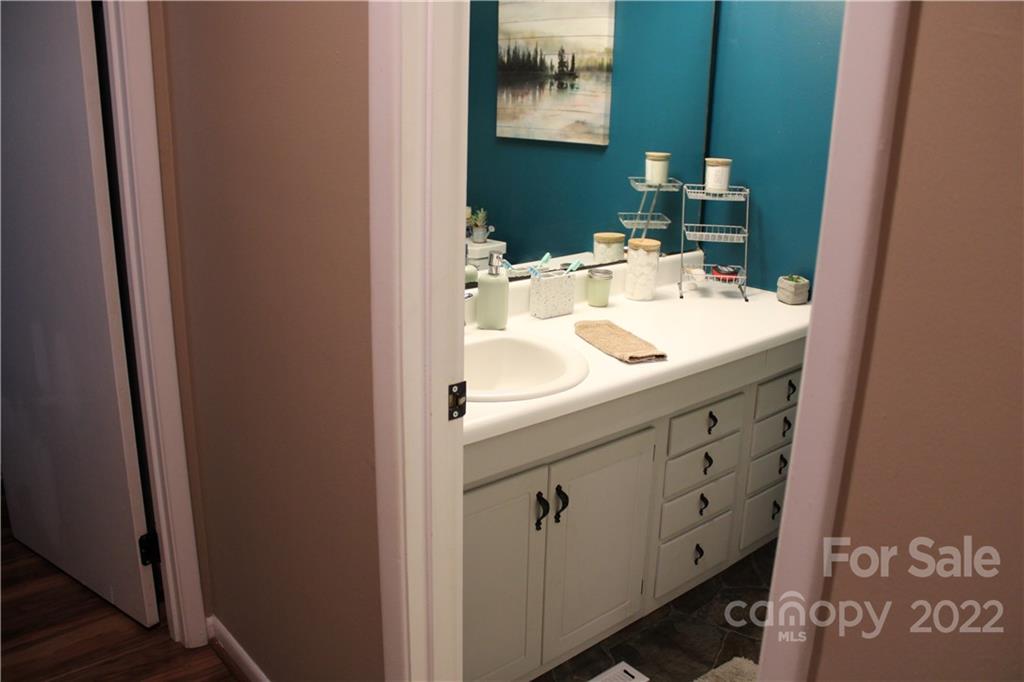 71 Shepard Square Brevard, NC 28712 - Photo 11 of 23 a bathroom with a sink and a mirror