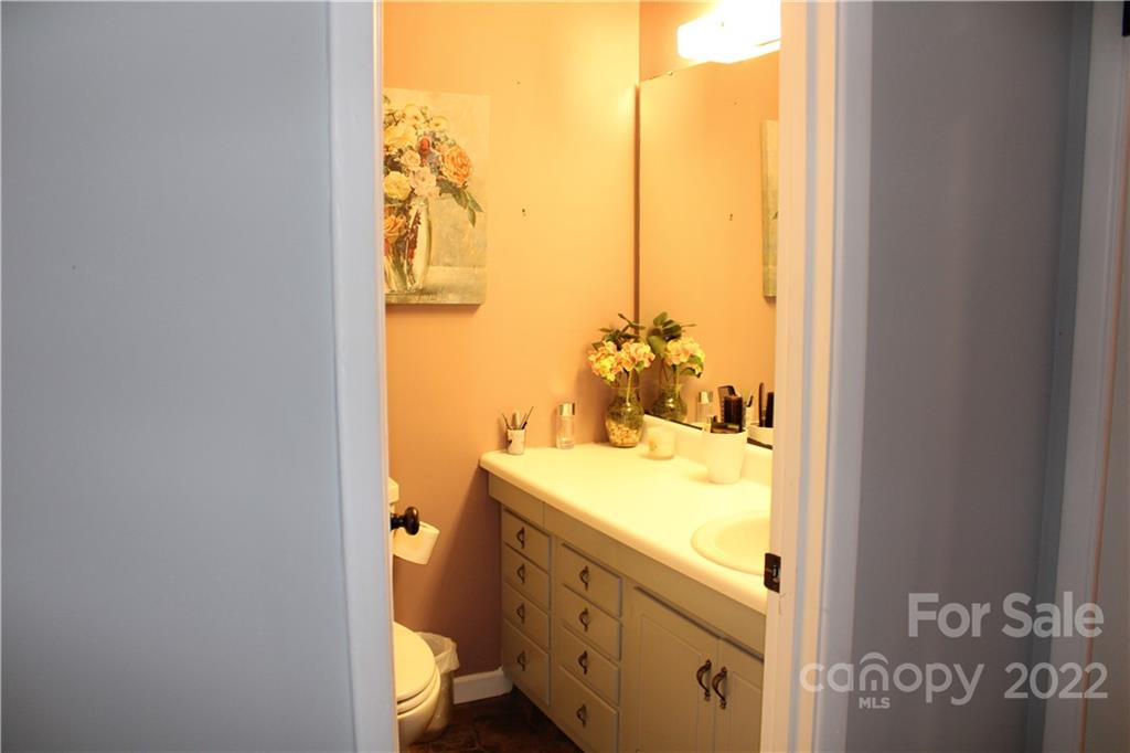 71 Shepard Square Brevard, NC 28712 - Photo 12 of 23 a bathroom with a granite countertop sink and a mirror