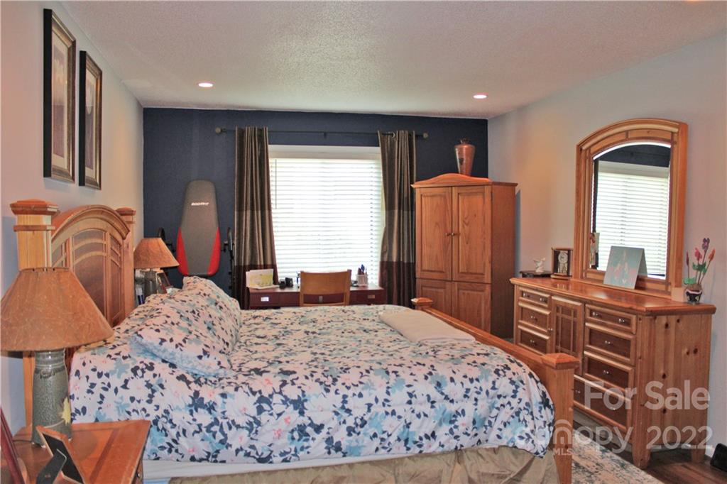 71 Shepard Square Brevard, NC 28712 - Photo 13 of 23 a bedroom with a bed and wooden floor