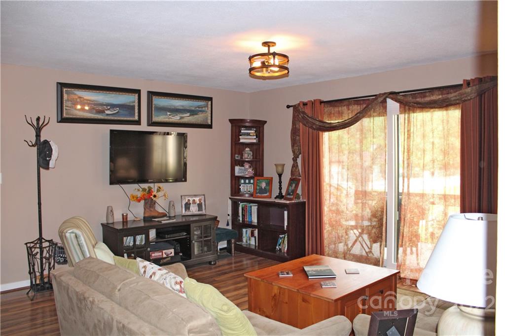 71 Shepard Square Brevard, NC 28712 - Photo 14 of 23 a living room with furniture a rug and a flat screen tv
