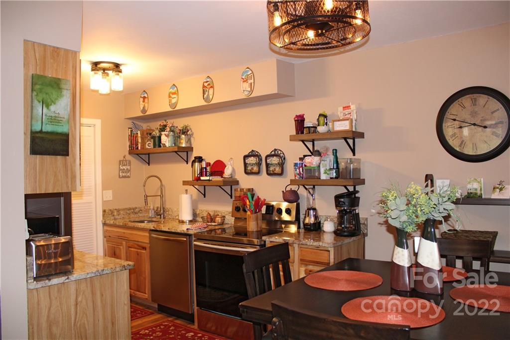 71 Shepard Square Brevard, NC 28712 - Photo 3 of 23 a kitchen with a refrigerator and a stove