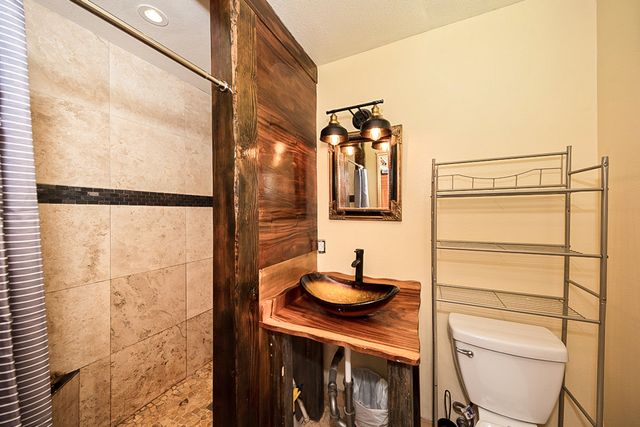 a bedroom with two beds and a large window