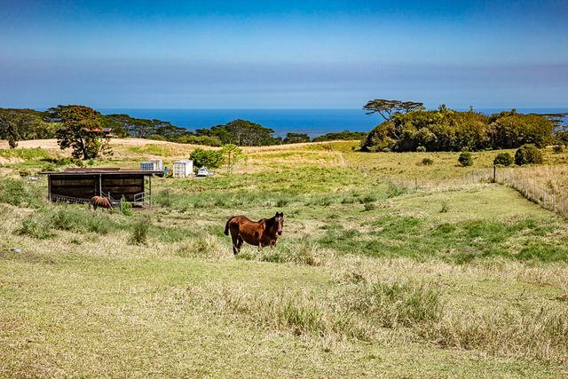 a view of ocean with sunset