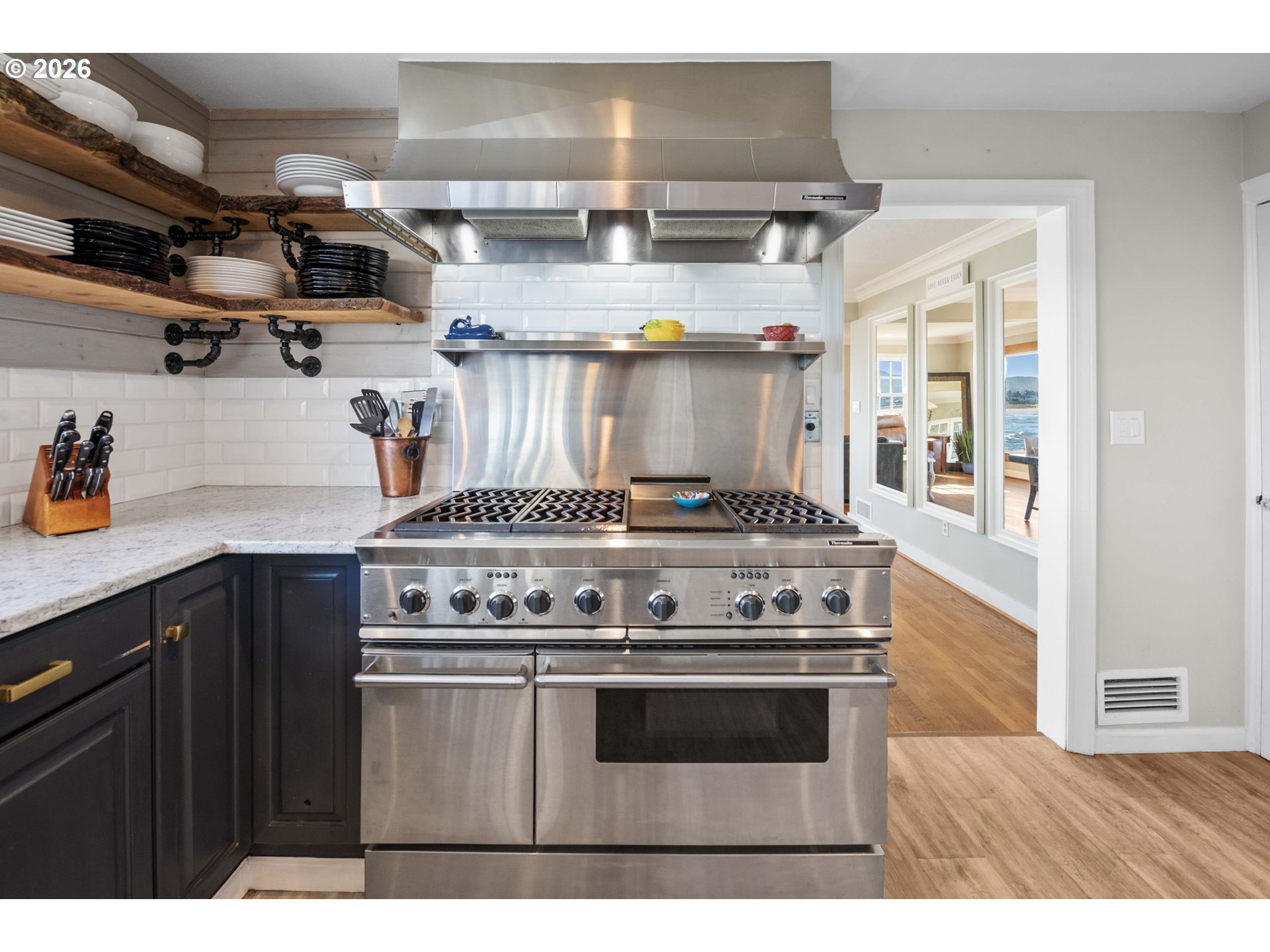 3232 Sunset Boulevard Seaside, OR 97138 - Photo 11 of 48 a kitchen with stainless steel appliances granite countertop a stove and a sink