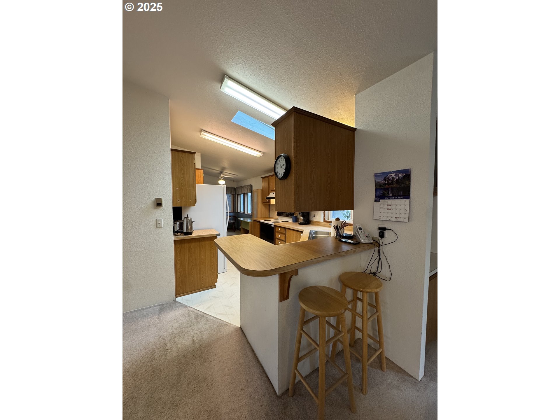 15619 Northeast Caples Road, Unit 72 Brush Prairie, WA 98606 - Photo 12 of 24 a room with a sink and chairs