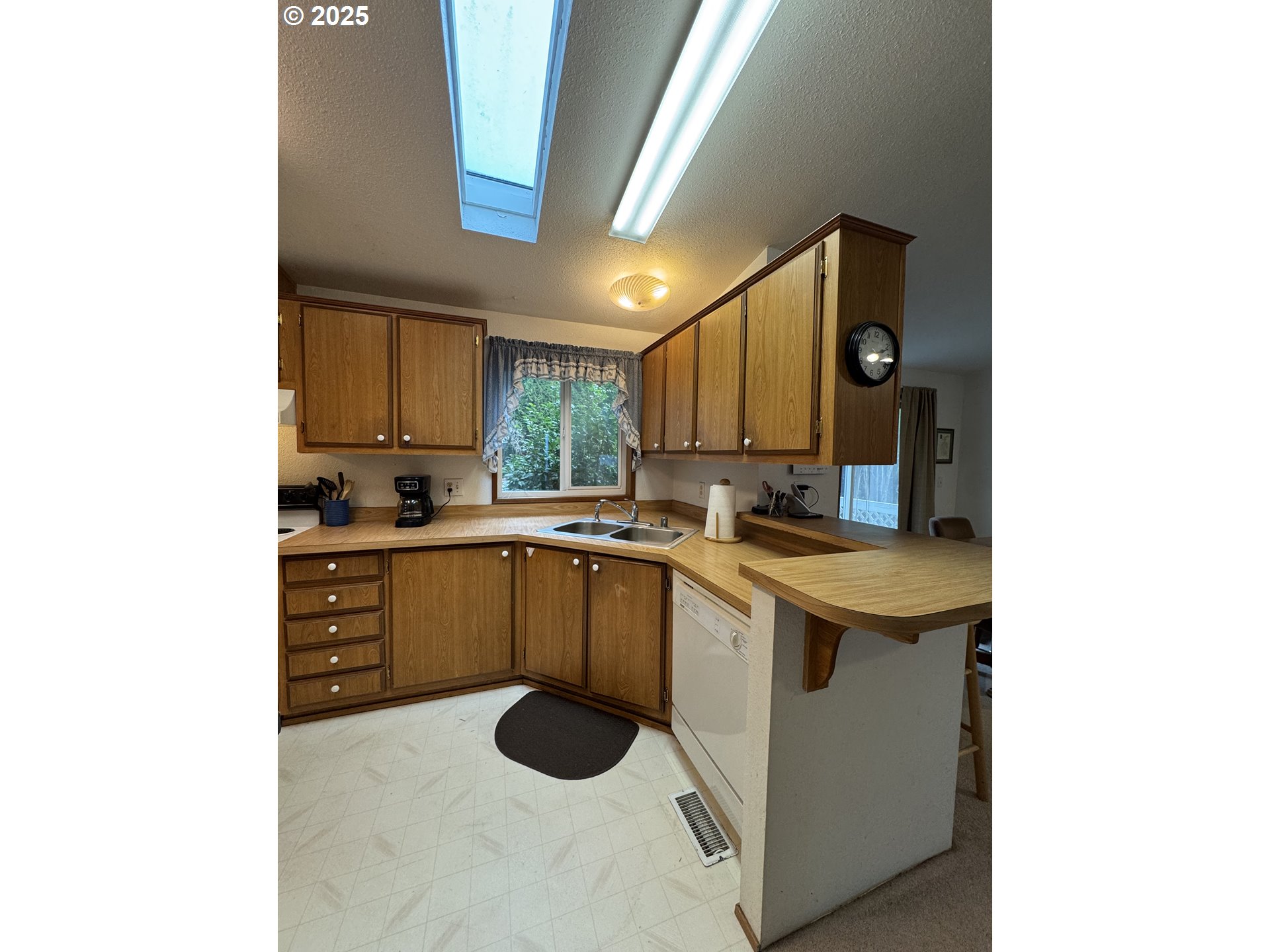 15619 Northeast Caples Road, Unit 72 Brush Prairie, WA 98606 - Photo 13 of 24 a kitchen with a sink cabinets and appliances