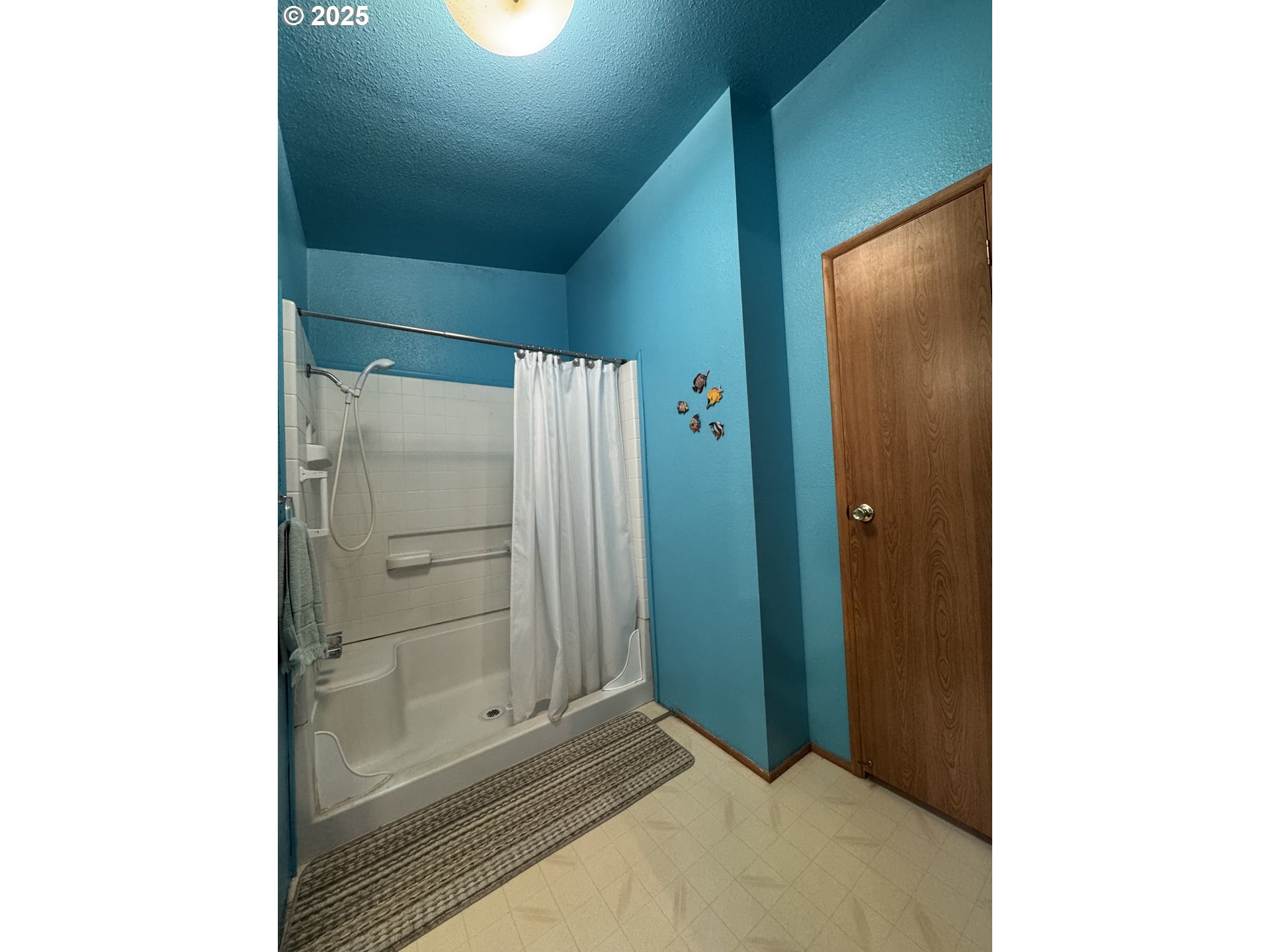 15619 Northeast Caples Road, Unit 72 Brush Prairie, WA 98606 - Photo 22 of 24 a view of a hallway with wooden floor