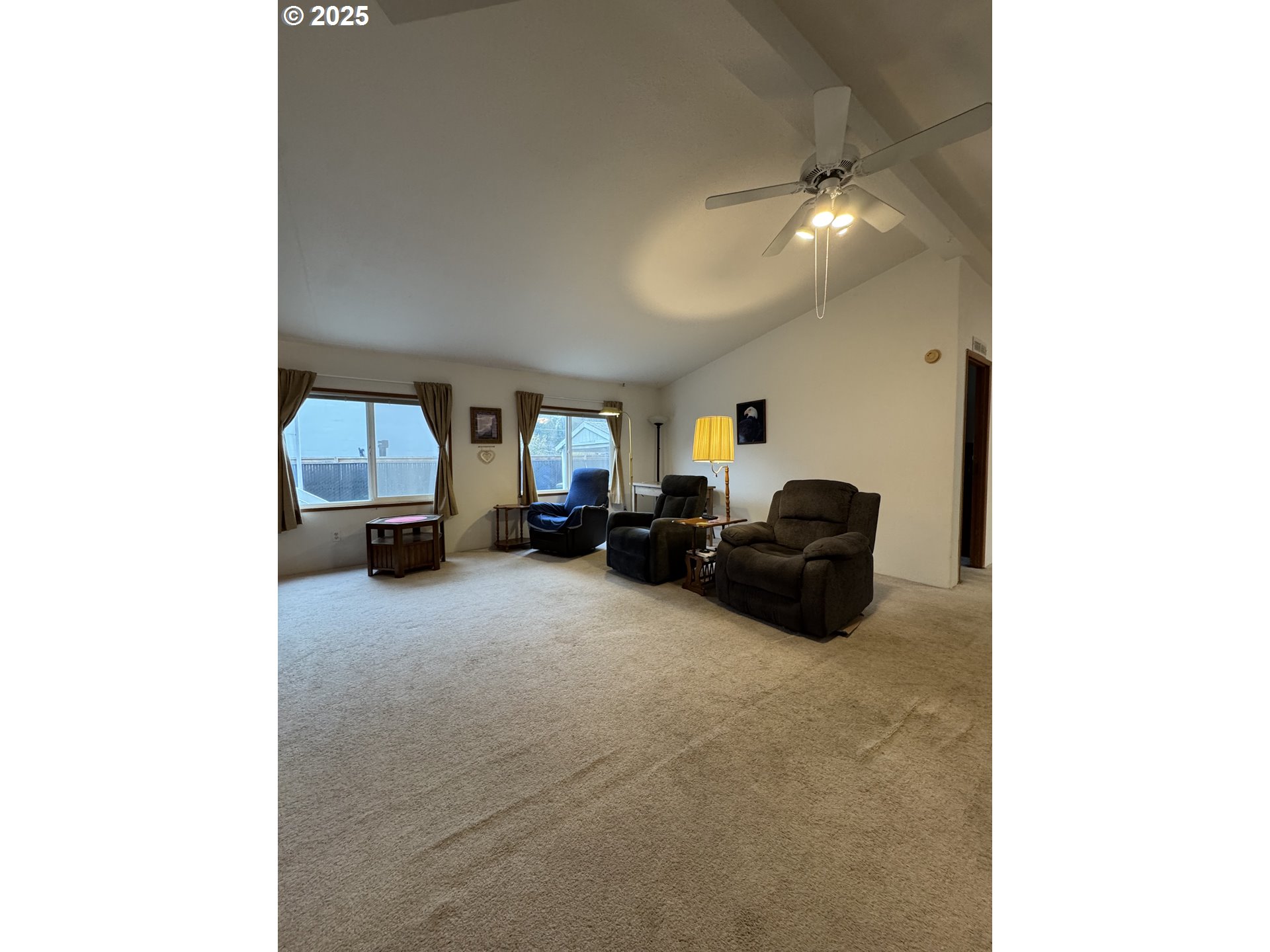 15619 Northeast Caples Road, Unit 72 Brush Prairie, WA 98606 - Photo 7 of 24 a living room with furniture and a large mirror