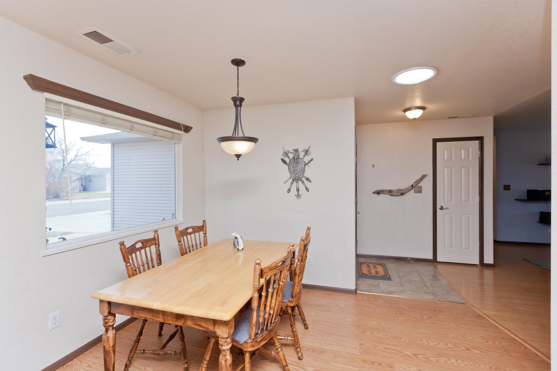 231 Narrow Leaf Drive Fruita, CO 81521 - Photo 19 of 40 a view of a dining room with furniture and a chandelier