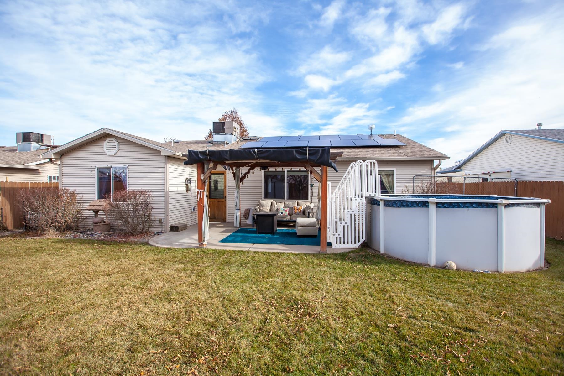 231 Narrow Leaf Drive Fruita, CO 81521 - Photo 30 of 40 a front view of a house with a garden and yard