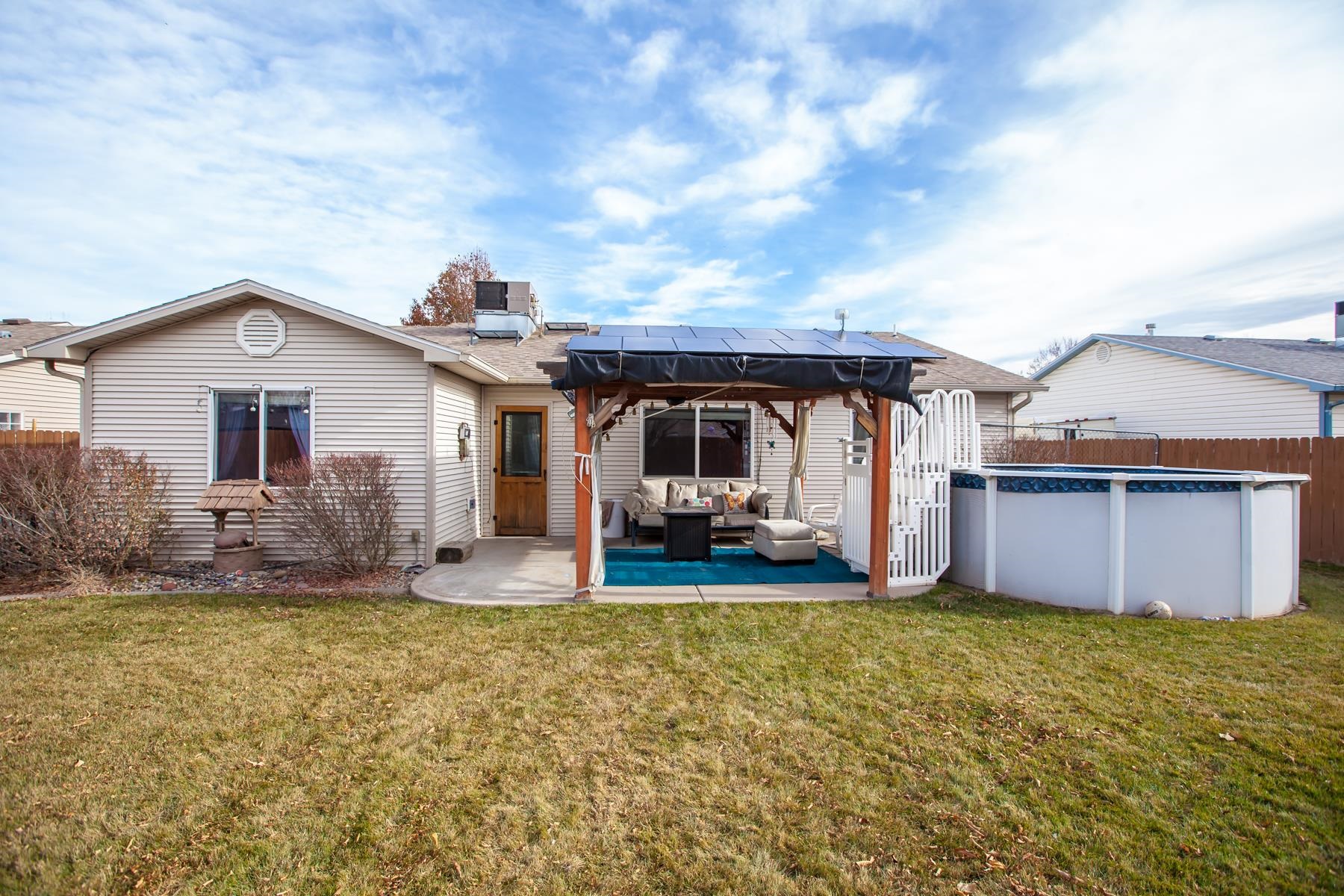 231 Narrow Leaf Drive Fruita, CO 81521 - Photo 31 of 40 a view of a house with backyard and sitting area