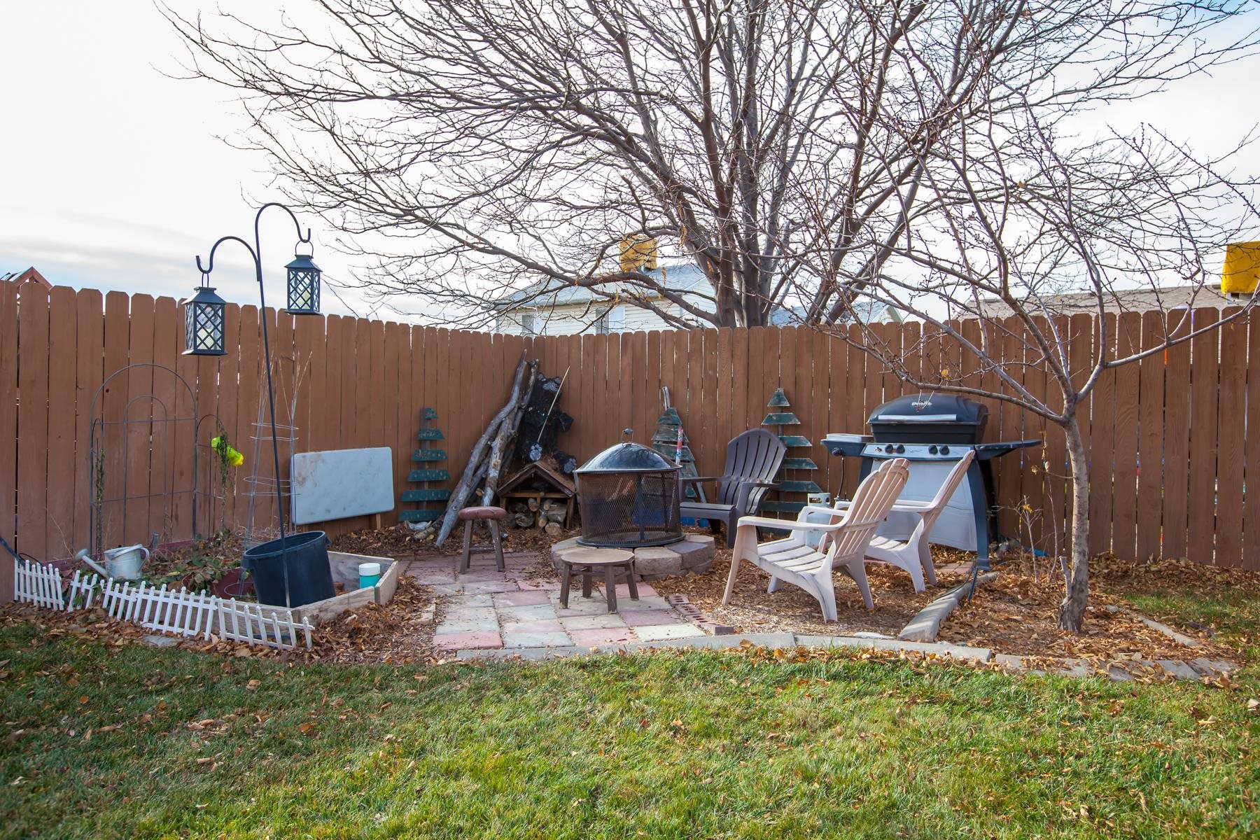 231 Narrow Leaf Drive Fruita, CO 81521 - Photo 34 of 40 a view of a chairs and table in backyard