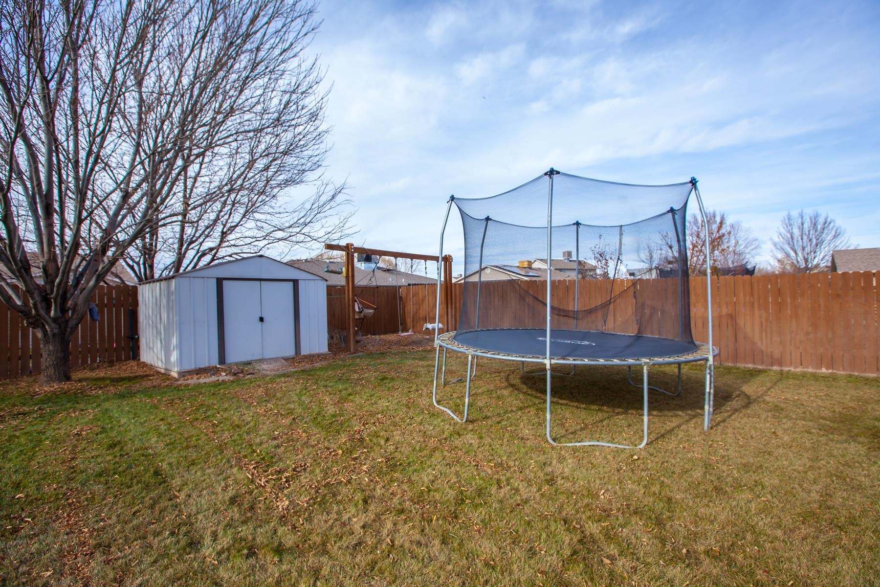 231 Narrow Leaf Drive Fruita, CO 81521 - Photo 35 of 40 a backyard of a house with table and chairs