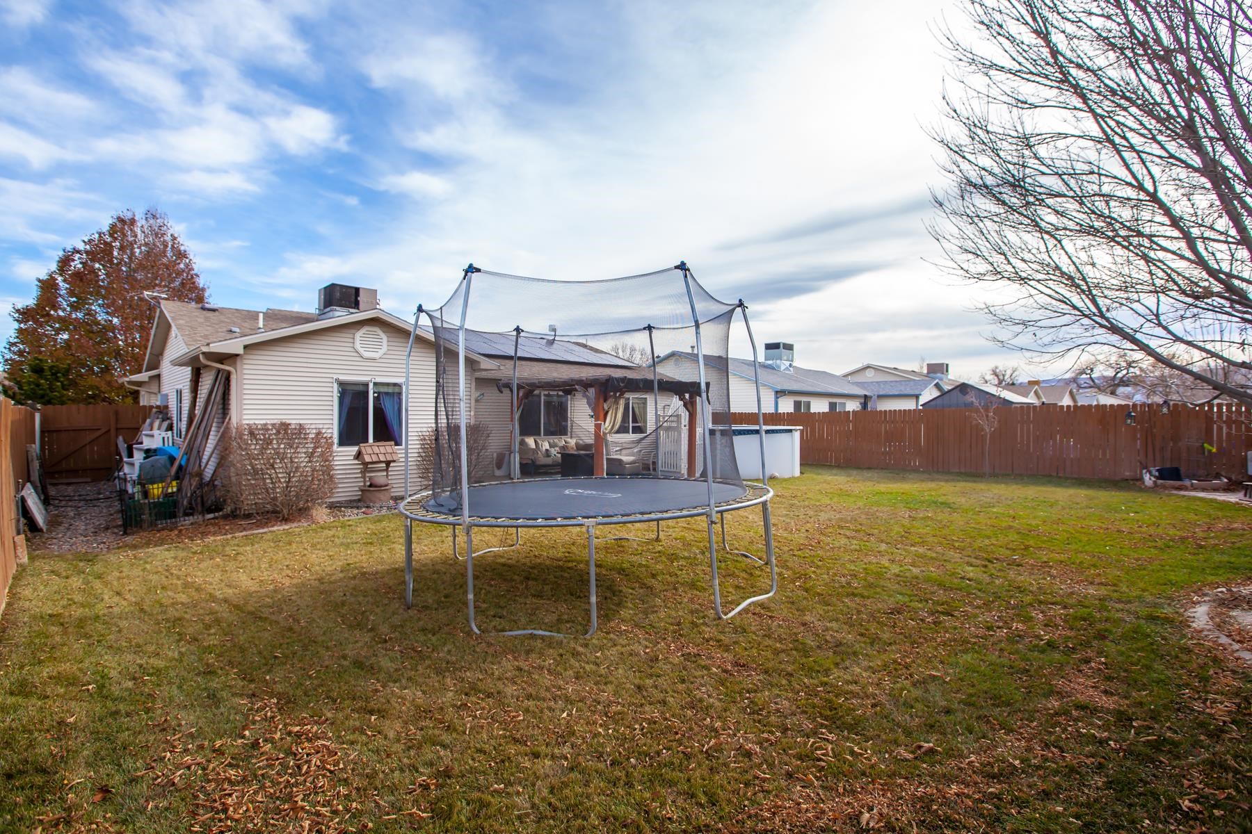 231 Narrow Leaf Drive Fruita, CO 81521 - Photo 38 of 40 a view of a house with a yard