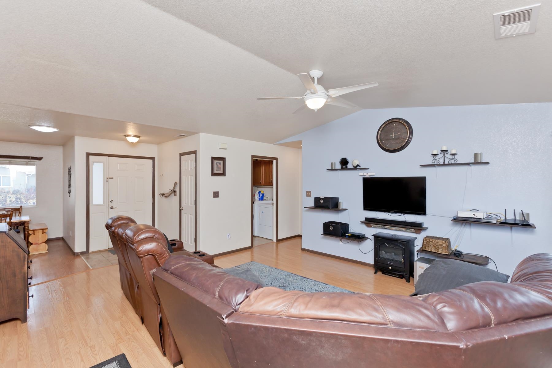 231 Narrow Leaf Drive Fruita, CO 81521 - Photo 7 of 40 a living room with furniture and a flat screen tv