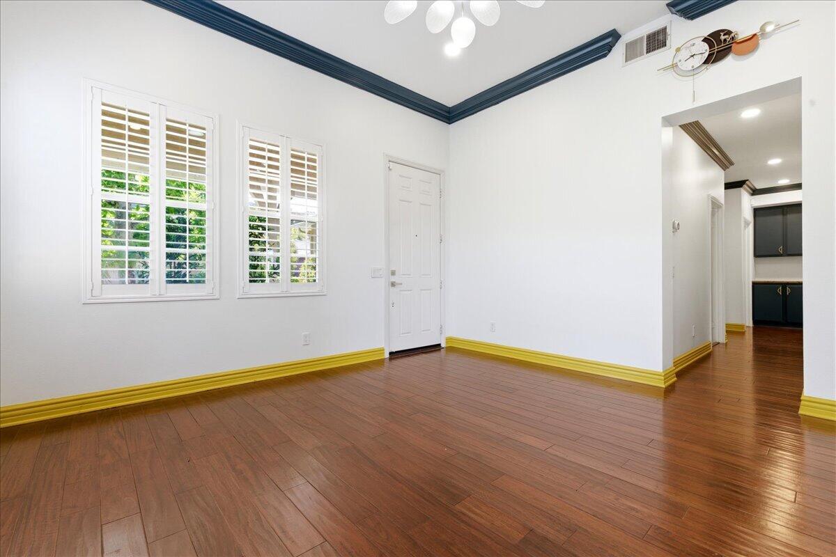23732 Bella Vista Road Corona, CA 92883 - Photo 7 of 49 an empty room with wooden floor and windows