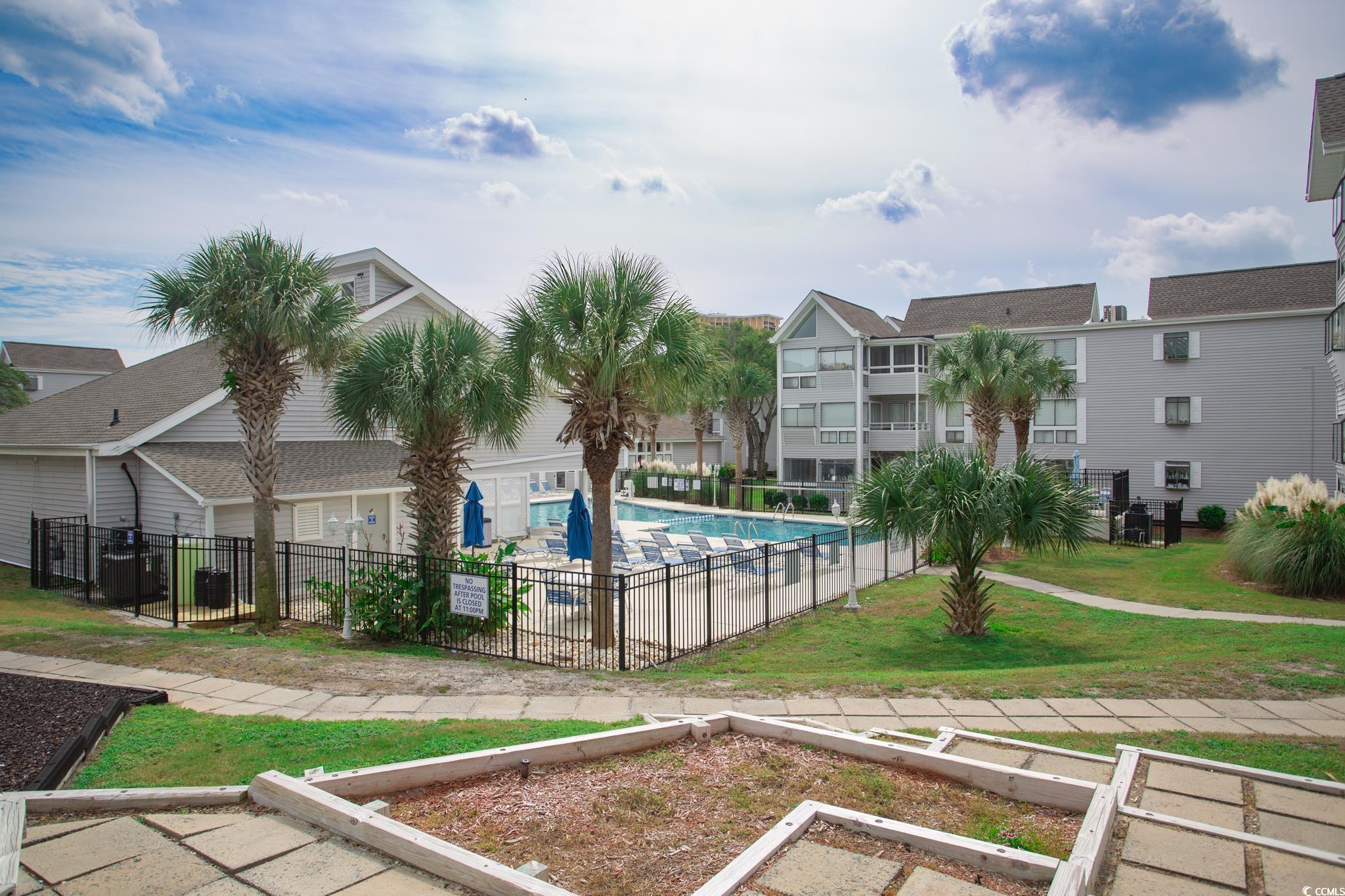 351 Lake Arrowhead Road, Unit 25404 Myrtle Beach, SC 29572 - Photo 28 of 37 View of pool featuring a yard