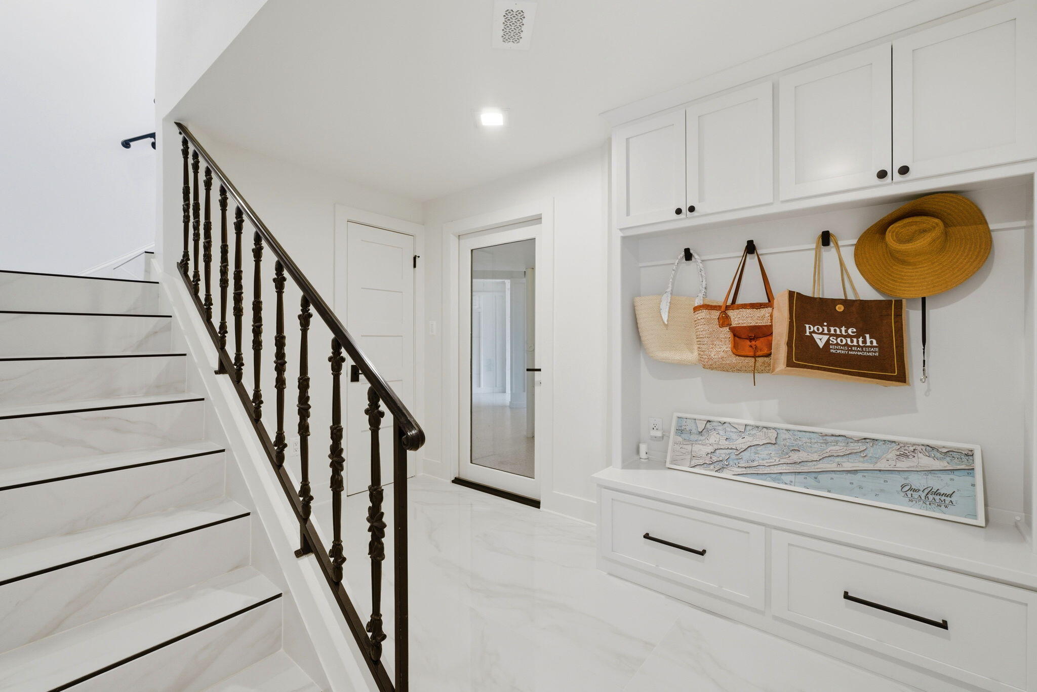 31061 Peninsula Drive Orange Beach, AL 36561 - Photo 27 of 93 a view of a kitchen with stainless steel appliances granite countertop cabinets and a wooden floor