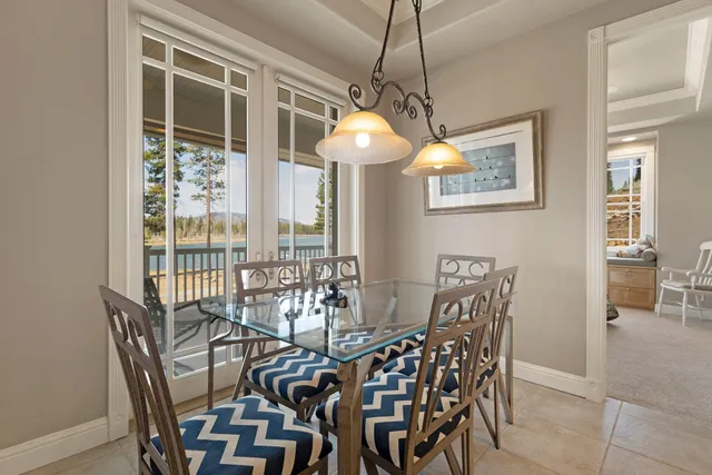 a view of a dining room with furniture and chandelier