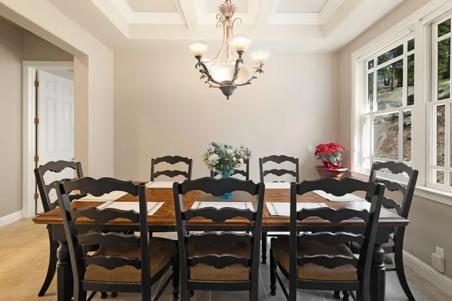 a bedroom with furniture and a large window