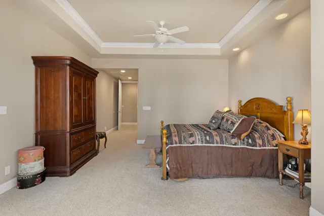a living room with furniture and large windows