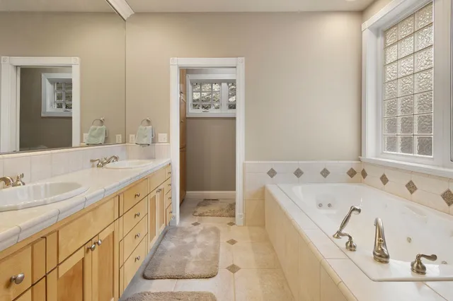 a bathroom with a bathtub and a shower